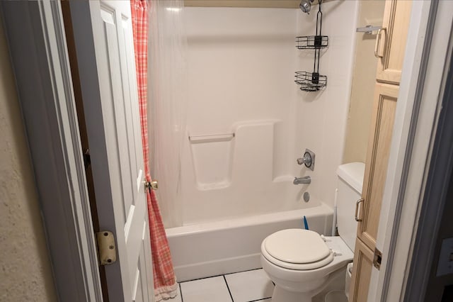 full bathroom with tile patterned flooring, shower / bath combo with shower curtain, toilet, and vanity