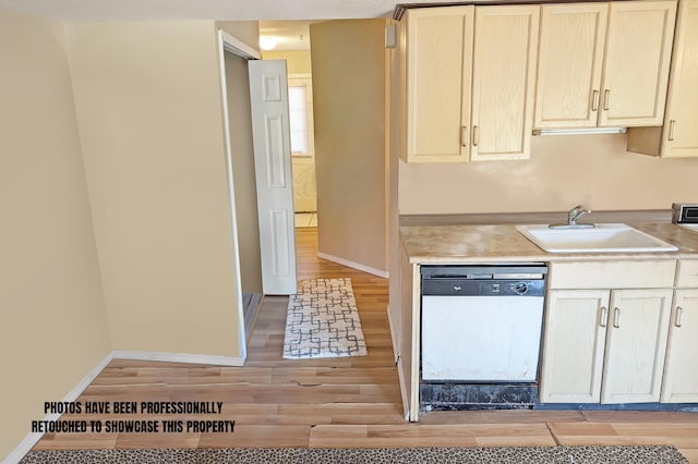 kitchen featuring dishwasher, light hardwood / wood-style floors, and sink