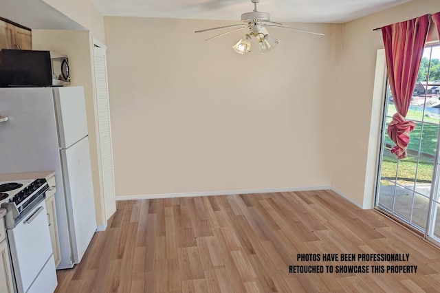 kitchen with white range with electric stovetop, ceiling fan, white cabinetry, and light hardwood / wood-style flooring