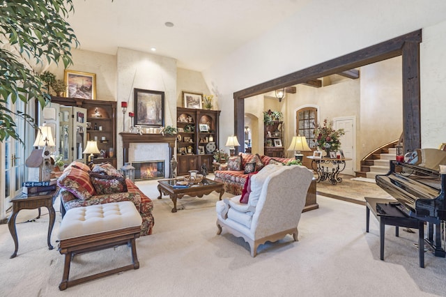 living room with light colored carpet and vaulted ceiling