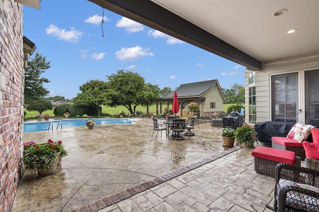 view of patio / terrace with a fenced in pool