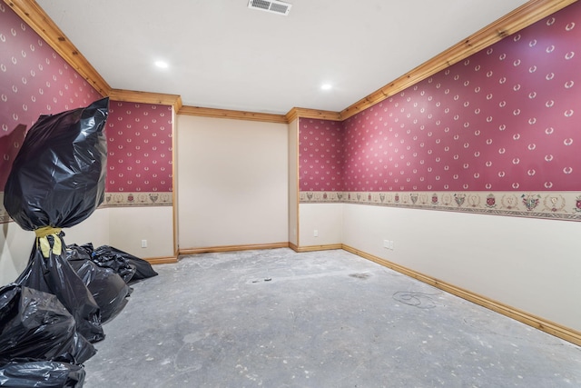 empty room featuring ornamental molding