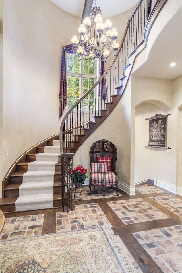 staircase with a high ceiling