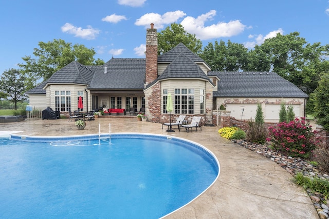 view of pool featuring a patio area