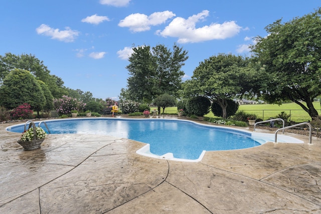 view of pool featuring a patio