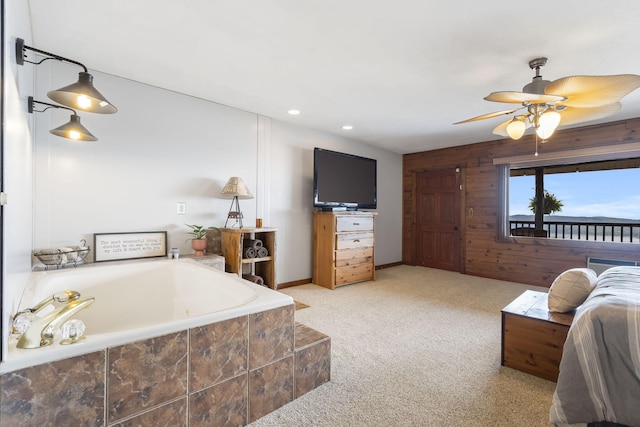 carpeted living room featuring ceiling fan