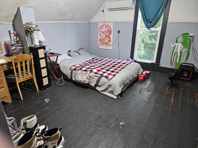 bedroom with dark wood-type flooring, an AC wall unit, and vaulted ceiling