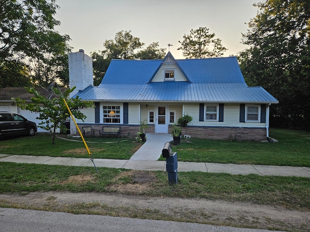 view of front of house with a yard