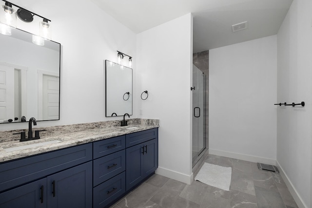 bathroom featuring walk in shower and vanity