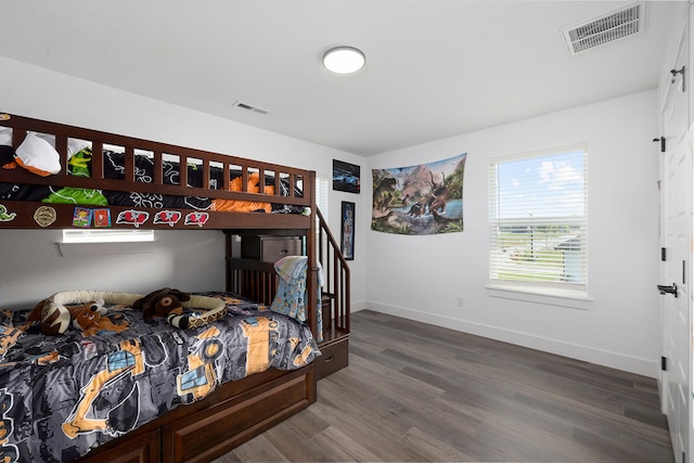 bedroom featuring wood-type flooring