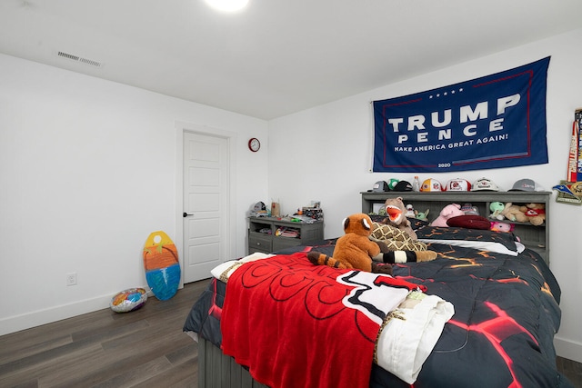 bedroom featuring dark wood-type flooring