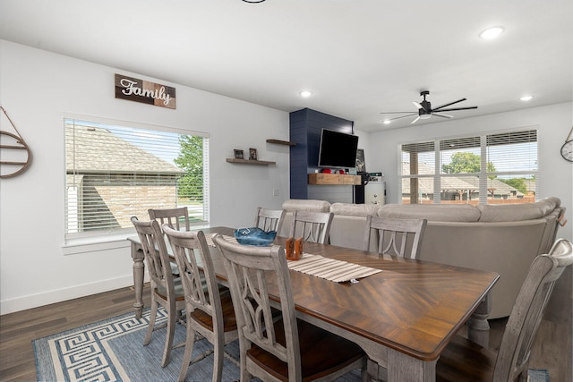 dining area featuring dark wood-type flooring, plenty of natural light, and ceiling fan