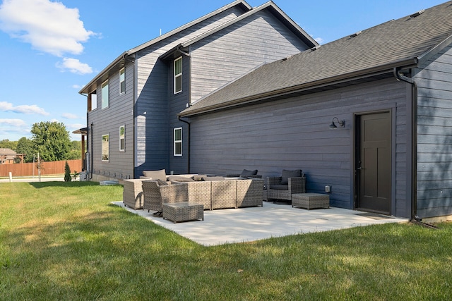 back of property featuring outdoor lounge area, a yard, and a patio area