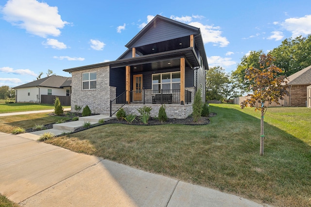 contemporary home with covered porch and a front yard