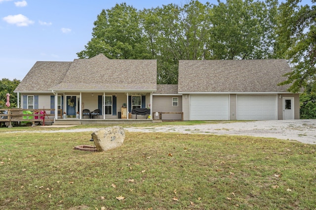 single story home featuring a front yard, a garage, and a deck