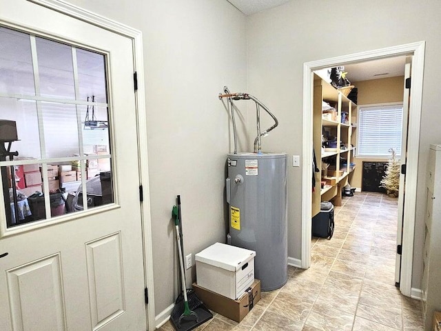 utility room featuring electric water heater