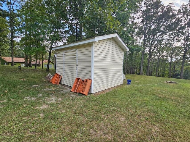 view of outdoor structure with a lawn