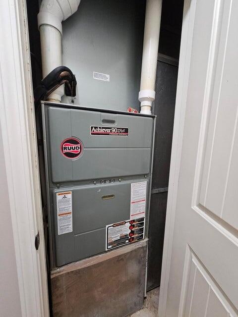 utility room with heating unit