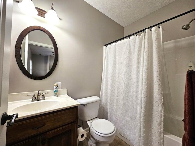 full bathroom with vanity, shower / bath combo with shower curtain, toilet, and a textured ceiling