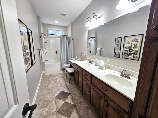 full bathroom featuring vanity, toilet, and shower / bath combo