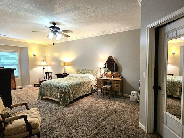 carpeted bedroom featuring ceiling fan, a textured ceiling, and crown molding