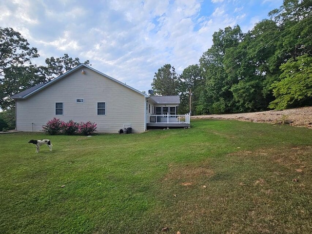 exterior space with a yard and a deck