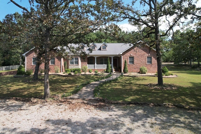 view of front of home featuring a front lawn and covered porch