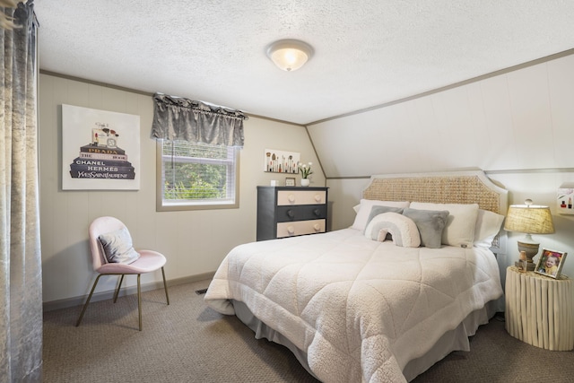 carpeted bedroom with vaulted ceiling and a textured ceiling