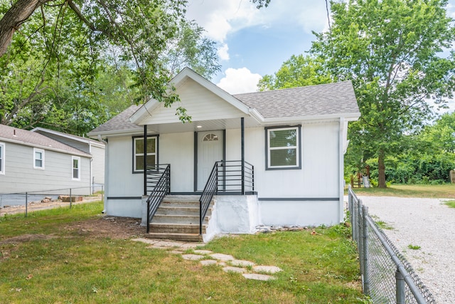 view of front of property with a front lawn and covered porch