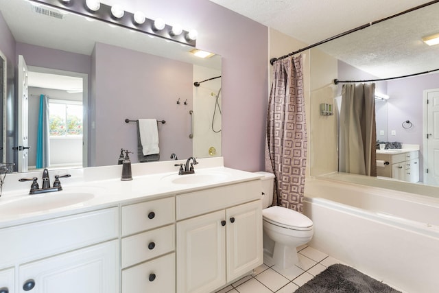 full bathroom featuring toilet, tile patterned flooring, vanity, and shower / bathtub combination with curtain