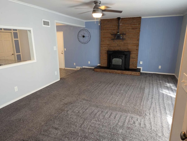 unfurnished living room featuring a fireplace, crown molding, carpet flooring, and ceiling fan