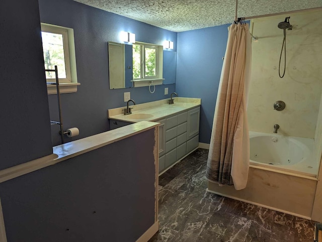 bathroom featuring shower / bath combo, a wealth of natural light, vanity, and a textured ceiling