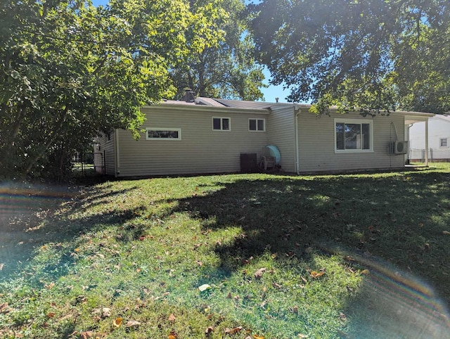 rear view of house with a lawn