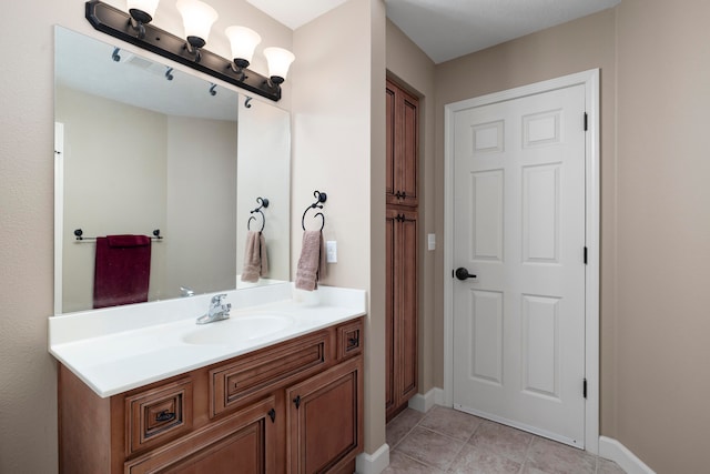 bathroom featuring tile patterned floors and vanity