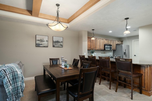 view of carpeted dining area