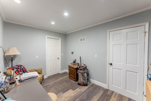 office area with ornamental molding and dark wood-type flooring