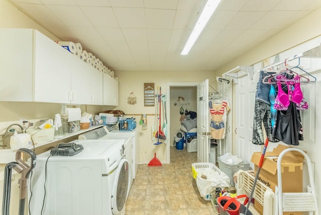 laundry area featuring cabinets and independent washer and dryer