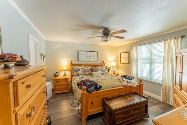 bedroom featuring dark wood-type flooring, ornamental molding, and ceiling fan