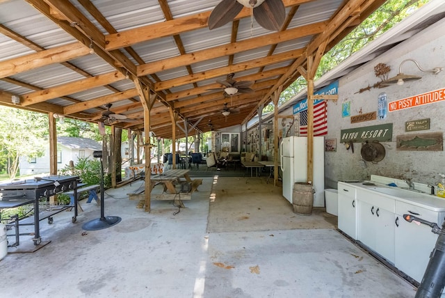 miscellaneous room with ceiling fan and vaulted ceiling