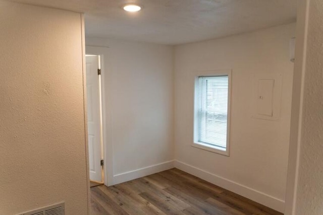 empty room with hardwood / wood-style floors