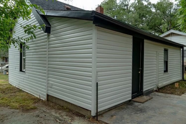 view of property exterior featuring a patio area