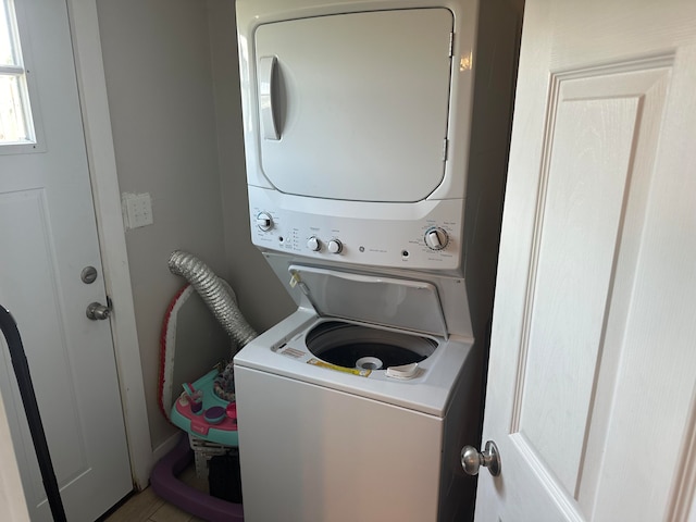 laundry room with stacked washer and clothes dryer