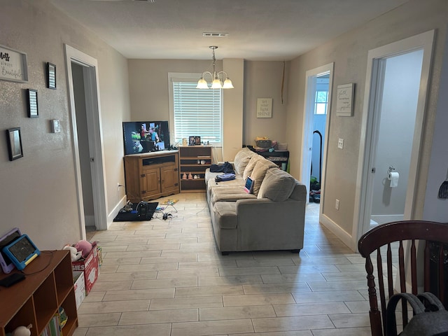 living room with a notable chandelier