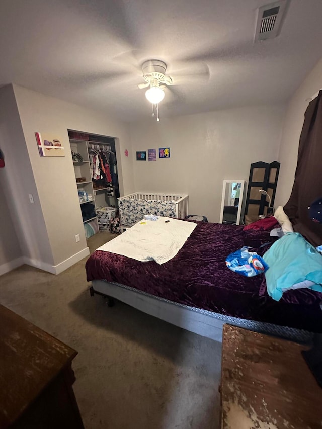 carpeted bedroom with ceiling fan