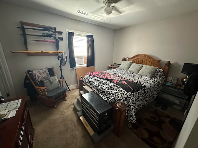 carpeted bedroom featuring cooling unit and ceiling fan