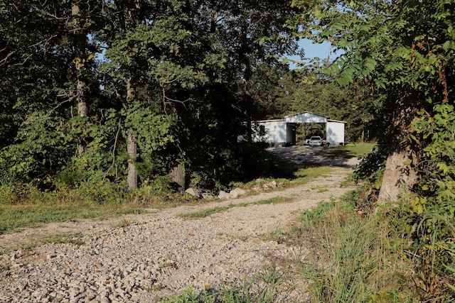 280 Forest View Dr, Seymour, MO 65746 - view of yard featuring dirt driveway, an outbuilding, and a pole building