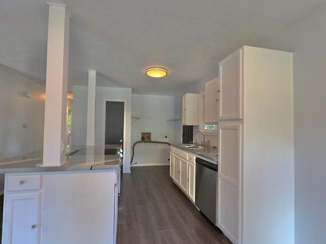 kitchen featuring dark hardwood / wood-style flooring, white cabinetry, sink, and dishwasher