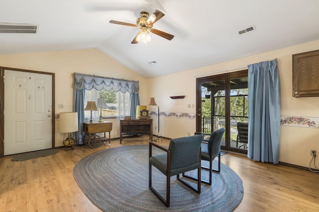 interior space featuring ceiling fan, light hardwood / wood-style flooring, and vaulted ceiling