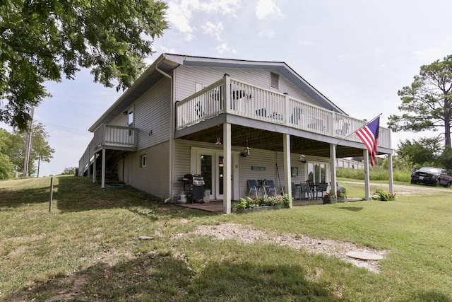 22016 Waters Edge Dr, Shell Knob, MO 65747 - back of property with a wooden deck, a patio area, and a lawn