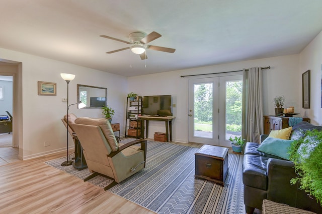 22016 Waters Edge Dr, Shell Knob, MO 65747 - living room with baseboards, a ceiling fan, and wood finished floors